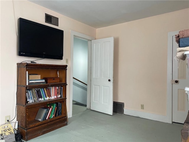 bedroom with visible vents and baseboards