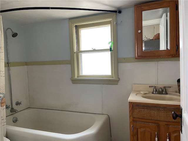 bathroom featuring shower / bath combination and vanity