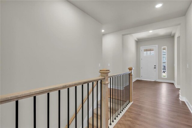 interior space featuring ornamental molding and hardwood / wood-style floors