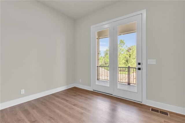 doorway featuring hardwood / wood-style flooring and plenty of natural light