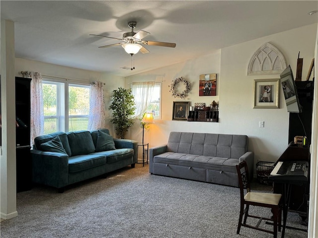 carpeted living room with ceiling fan