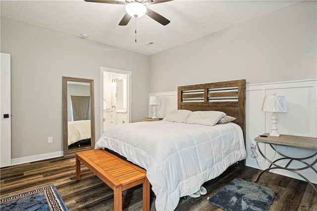 bedroom with ceiling fan, connected bathroom, and dark hardwood / wood-style floors