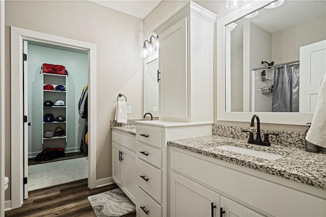 bathroom with vanity and hardwood / wood-style floors