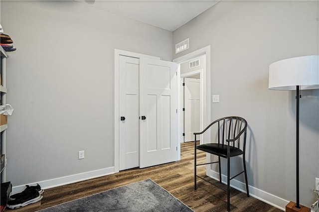 sitting room with dark hardwood / wood-style flooring