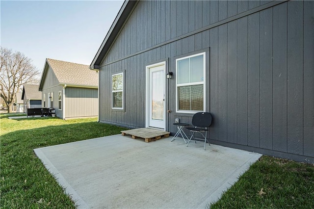 rear view of house with a patio area and a yard