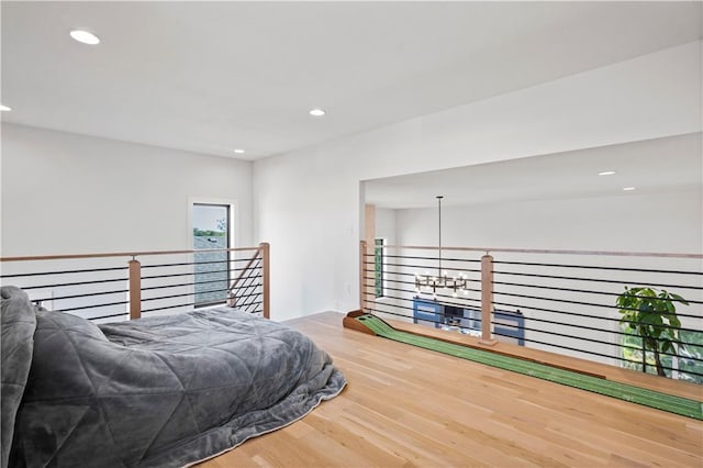 bedroom with hardwood / wood-style floors