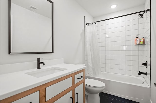 full bathroom featuring shower / bath combo, vanity, tile patterned floors, and toilet