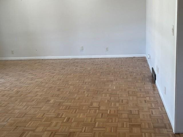 empty room with light parquet flooring