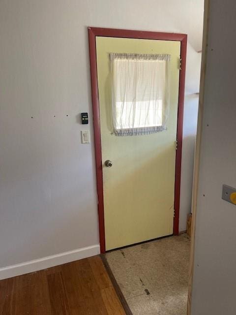 entryway with wood-type flooring