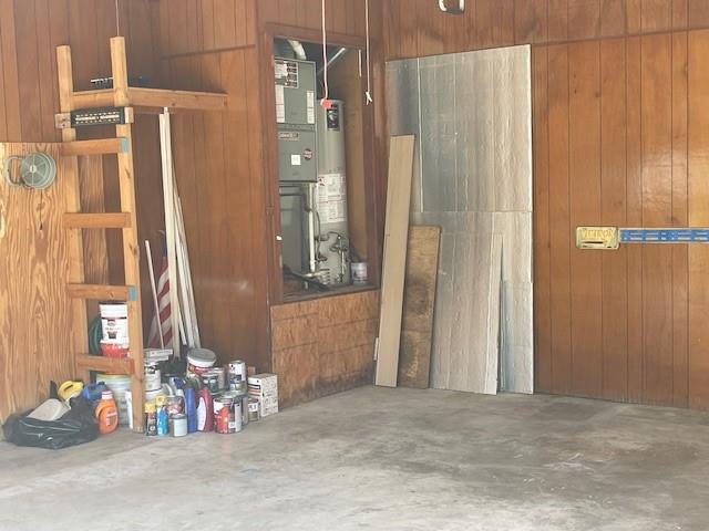 garage featuring wooden walls