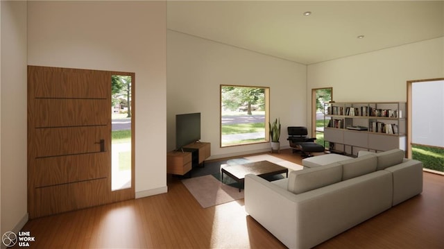 living room featuring hardwood / wood-style flooring and a high ceiling