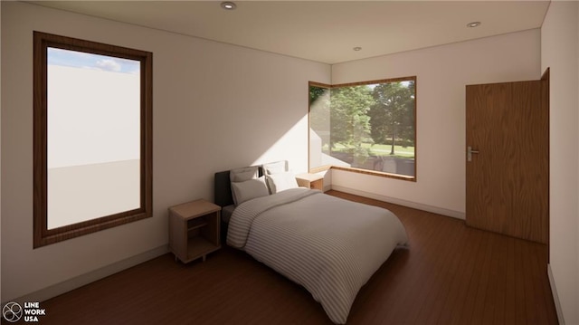 bedroom with dark hardwood / wood-style floors