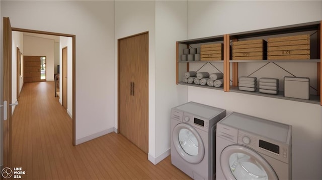 clothes washing area featuring separate washer and dryer and light wood-type flooring