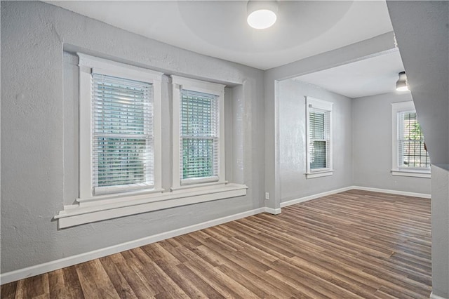 unfurnished room featuring hardwood / wood-style floors