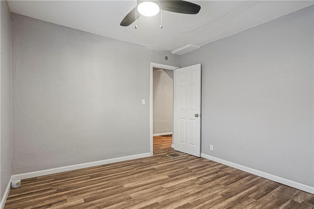 unfurnished room featuring ceiling fan and hardwood / wood-style flooring