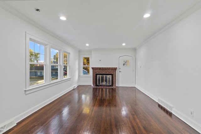 unfurnished living room with crown molding, dark hardwood / wood-style floors, and a fireplace