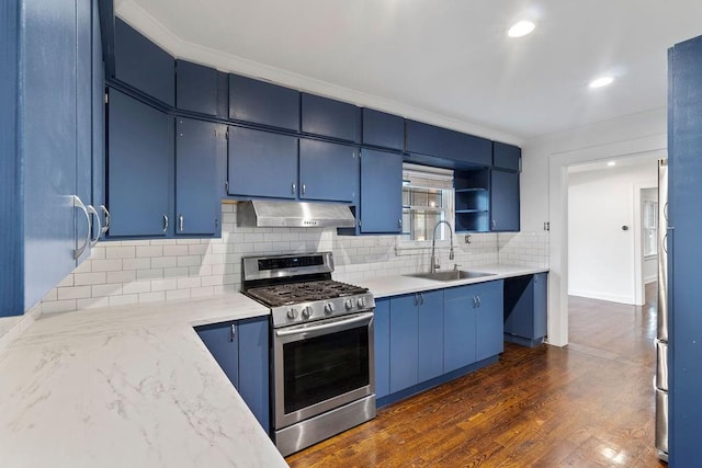 kitchen with blue cabinetry, stainless steel gas range oven, and sink