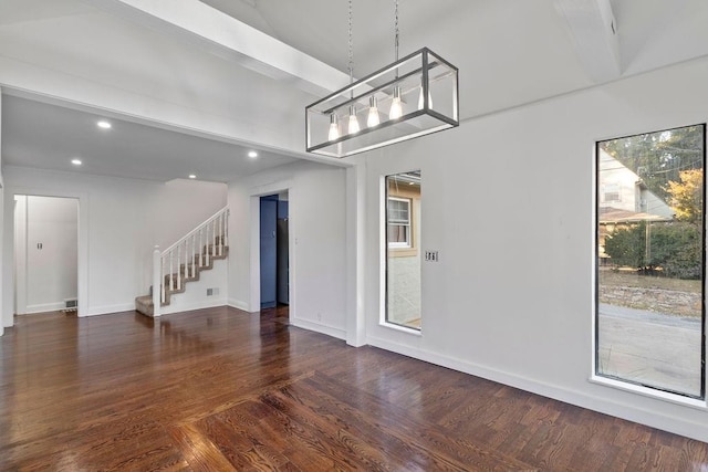 spare room featuring dark hardwood / wood-style floors