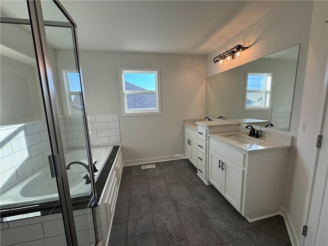 bathroom featuring vanity and plus walk in shower