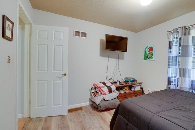 bedroom featuring light hardwood / wood-style flooring