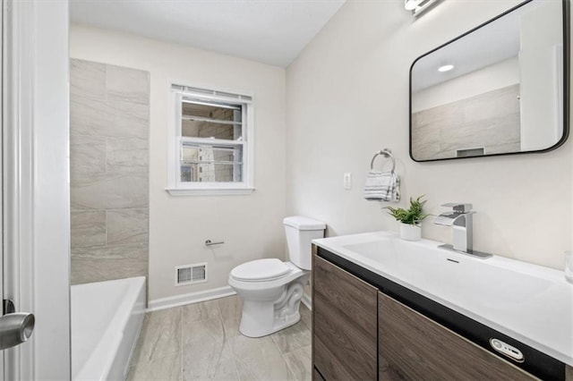 full bathroom featuring vanity, toilet, and tiled shower / bath