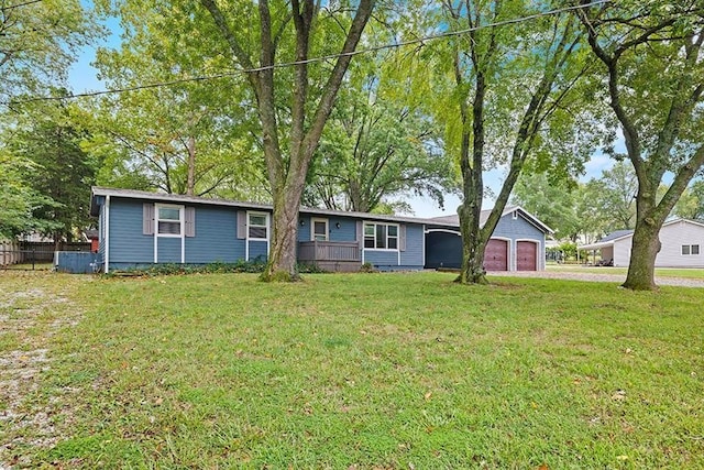 single story home with a front yard and a garage