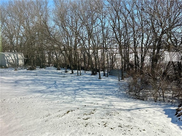 view of yard layered in snow