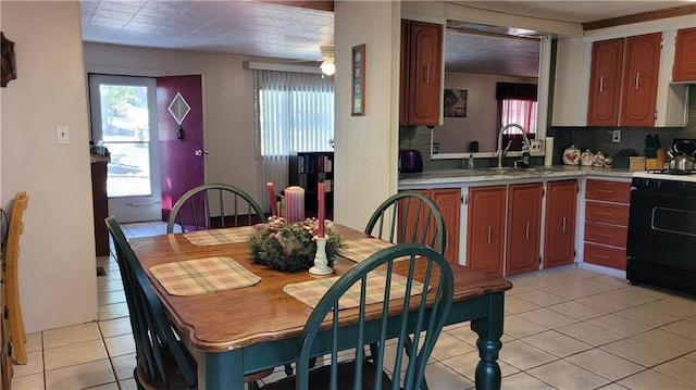 28530 Shore Rd, Warsaw, MO 65355 - kitchen with range with gas stovetop, backsplash, light tile patterned flooring, and light countertops