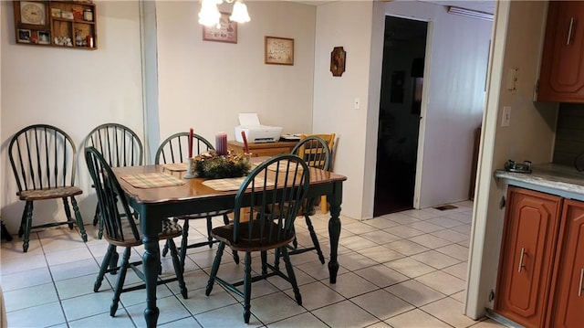 dining area with light tile patterned floors