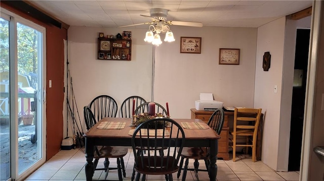 dining area featuring light tile patterned flooring and ceiling fan