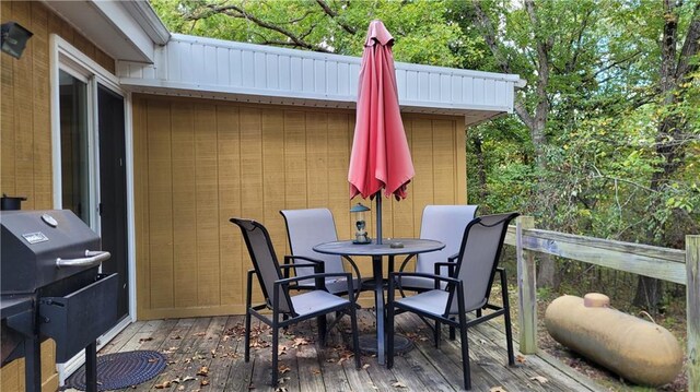 28530 Shore Rd, Warsaw, MO 65355 - wooden terrace with outdoor dining space and area for grilling