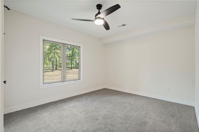 empty room featuring carpet and ceiling fan