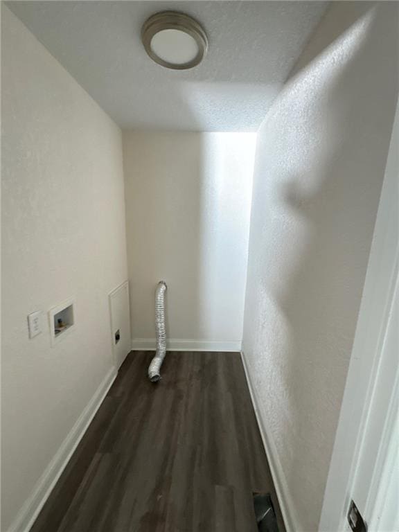 laundry area with dark hardwood / wood-style flooring, washer hookup, and electric dryer hookup