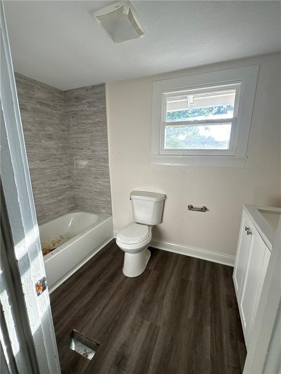 bathroom featuring hardwood / wood-style floors, vanity, and toilet