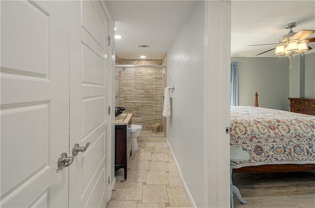 bathroom with ceiling fan, vanity, an enclosed shower, and toilet