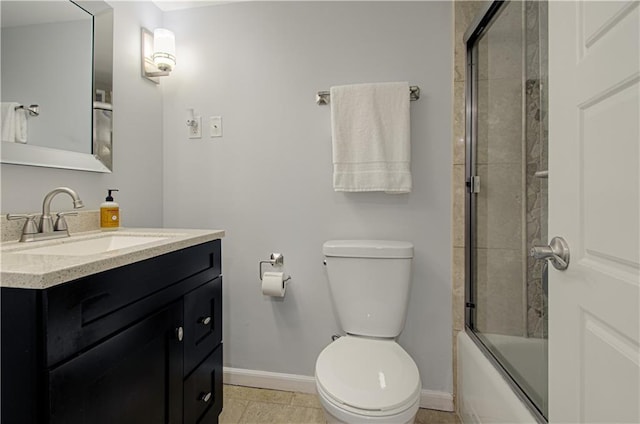 full bathroom with tile patterned flooring, vanity, toilet, and bath / shower combo with glass door