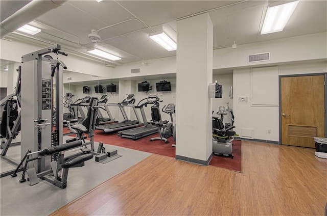 gym featuring wood-type flooring