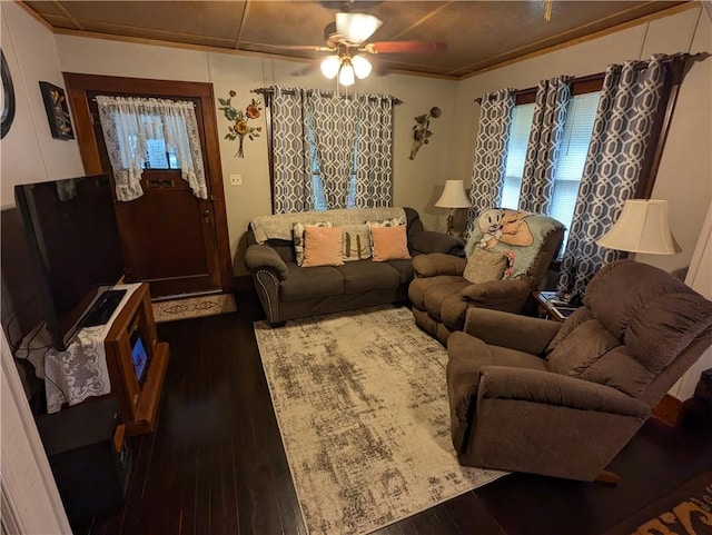 living room with a wealth of natural light, ceiling fan, and dark hardwood / wood-style floors