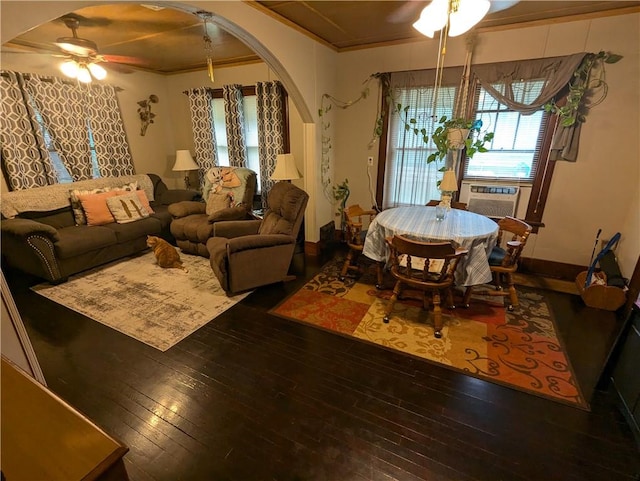 living room with cooling unit, hardwood / wood-style flooring, ceiling fan, and crown molding