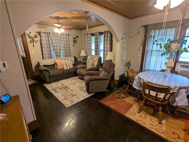 living room with ceiling fan, wood-type flooring, and crown molding