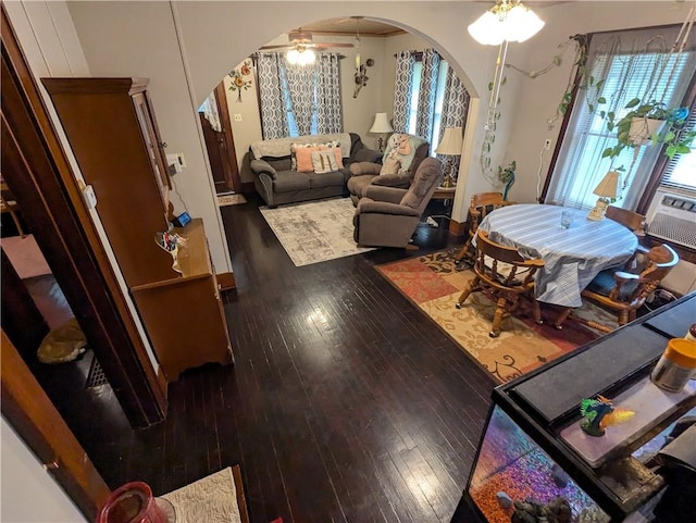 living room featuring ceiling fan, hardwood / wood-style floors, and cooling unit