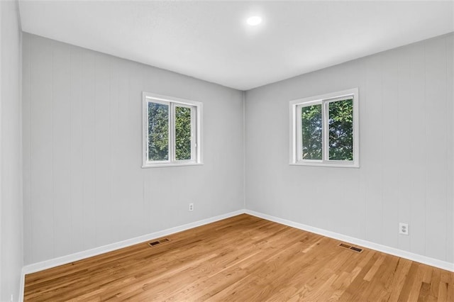 unfurnished room featuring hardwood / wood-style floors