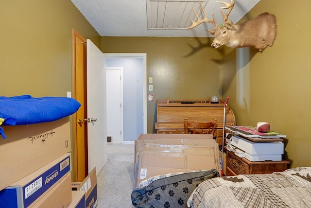 carpeted bedroom featuring a textured ceiling