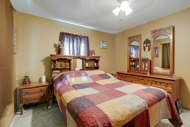 carpeted bedroom with a ceiling fan