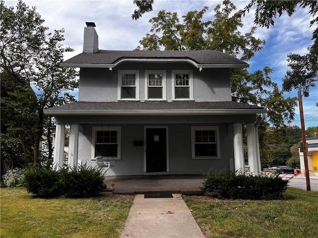 view of front of home featuring a porch and a front yard