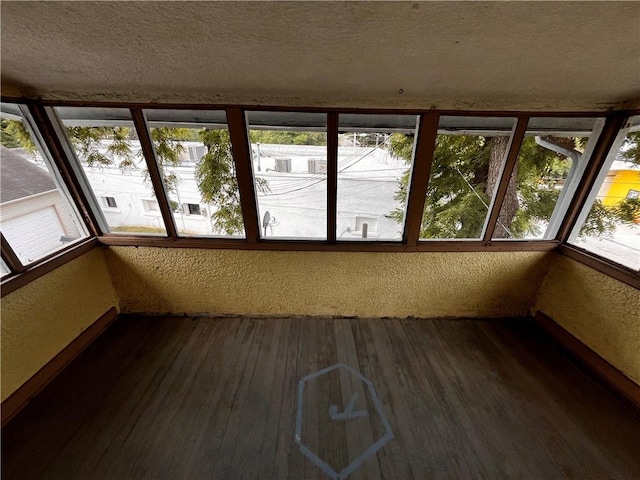 unfurnished sunroom featuring plenty of natural light