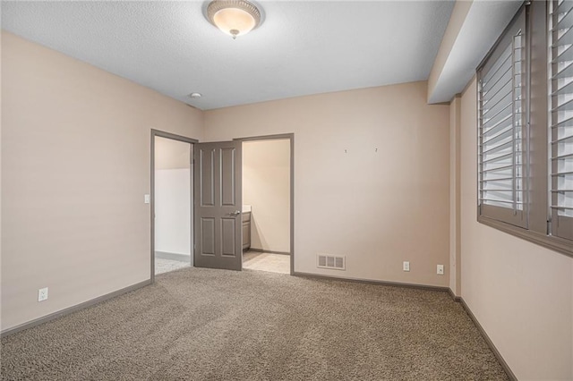 unfurnished bedroom with light carpet