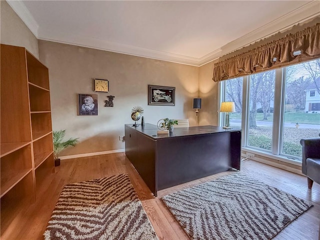 home office with crown molding and light wood-type flooring