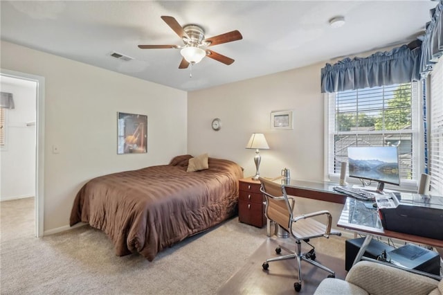 bedroom with light colored carpet and ceiling fan