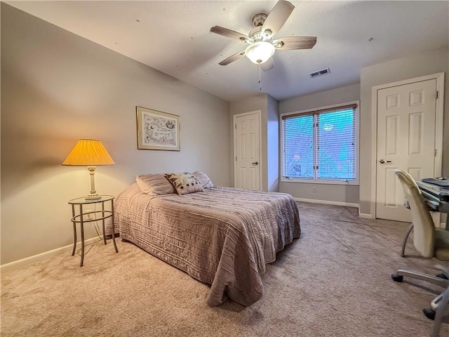 carpeted bedroom with ceiling fan